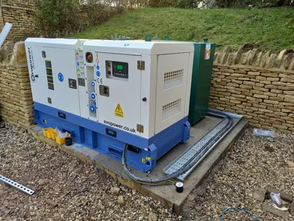 Professionally installed home backup generator system connected to an exterior electrical control panel.