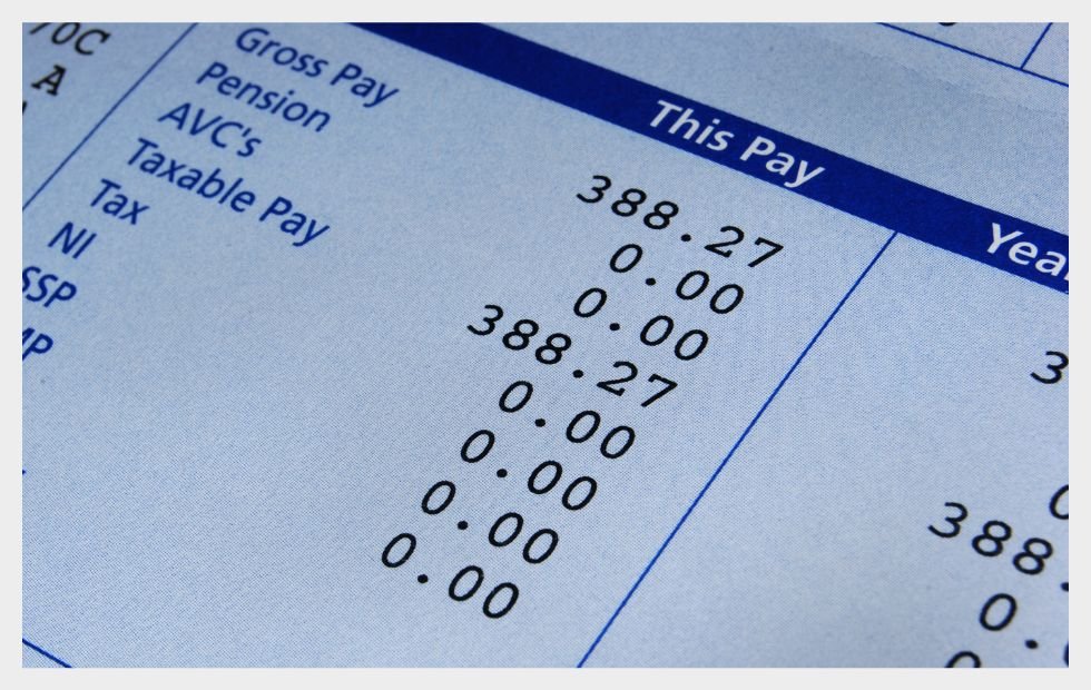 Close-up of a pay stub highlighting paycheck optimization details and earnings breakdown for better financial planning.