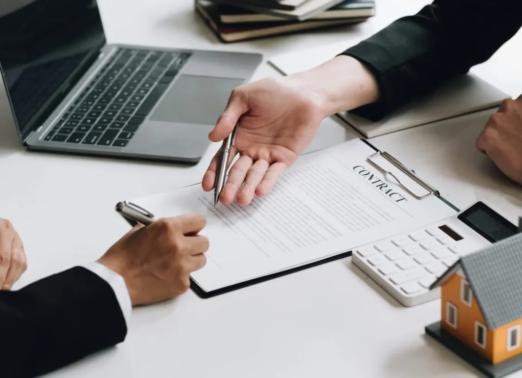 Investment property loan specialist and his client are working on a Investment property contract 