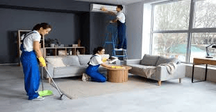 Deep cleaning service expert thoroughly cleaning a modern living room to remove dust and maintain a healthy indoor environment