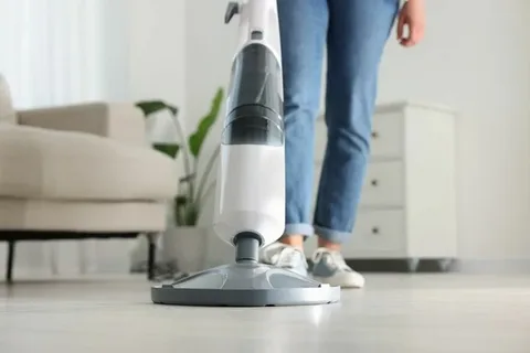 Microfiber mop cleaning wet interior floors using high-rated best floor cleaner products