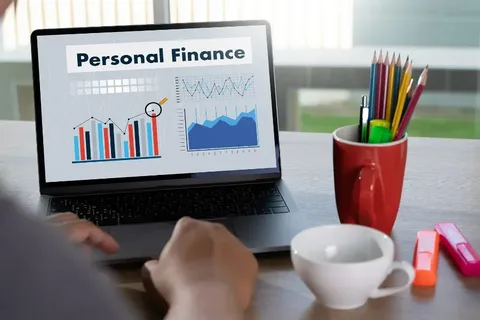 Man using a laptop for personal financial budgeting and tracking digital savings